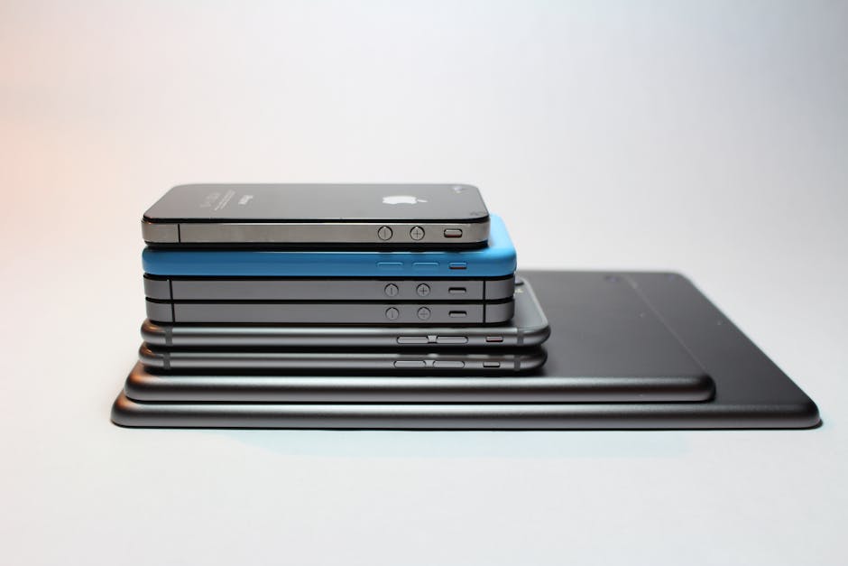Stacked modern smartphones and tablets showcasing sleek design